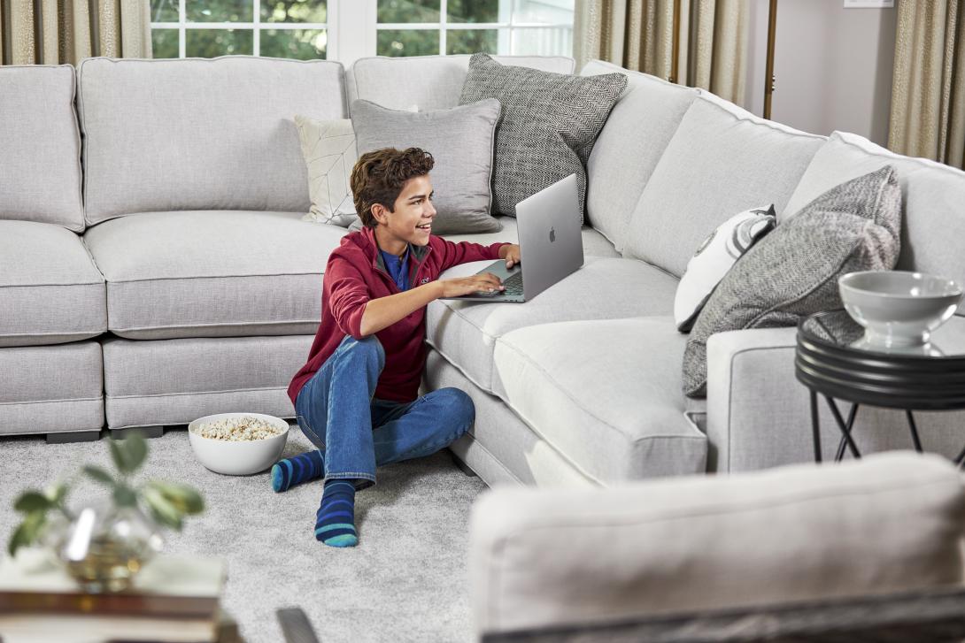 boy by couch after a carpet cleaning in spring tx